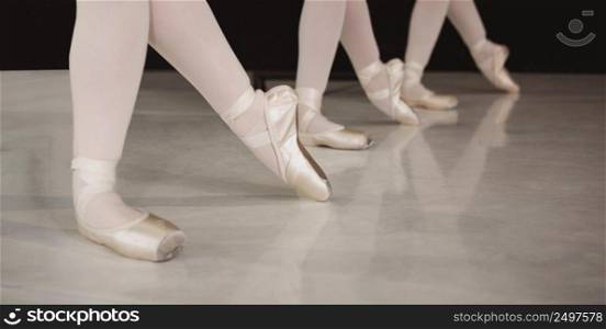 front view professional ballerinas rehearsing pointe shoes