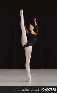 front view professional ballet dancer practicing alone