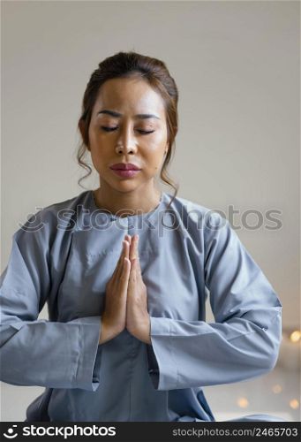 front view religious woman praying