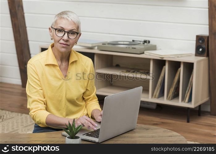 front view senior woman looking through internet her laptop