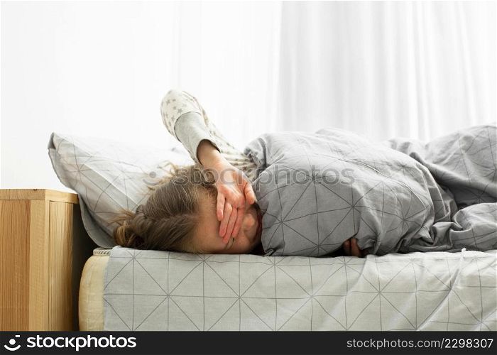 front view sleeping girl waking up