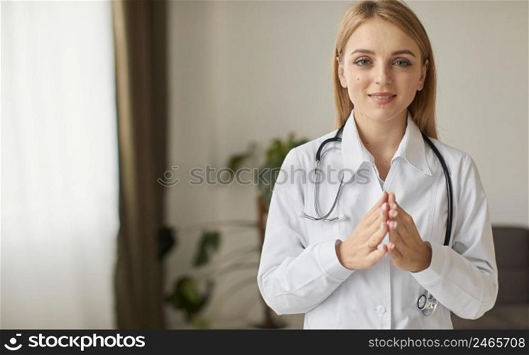 front view smiley covid recovery center female doctor praying