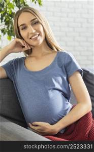 front view smiley pregnant businesswoman