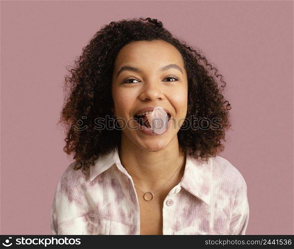 front view smiley woman with chewing gum