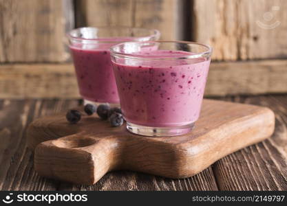 front view smoothie glasses with blueberries