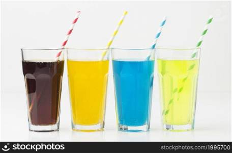 front view soft drinks glasses with straws