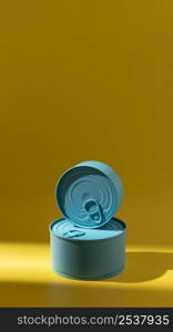 front view stack blue round tin cans with copy space