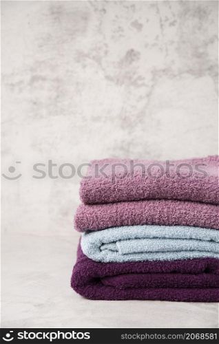 front view stacked colourful towels