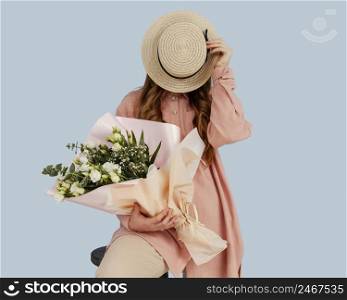 front view stylish woman posing with bouquet spring flowers