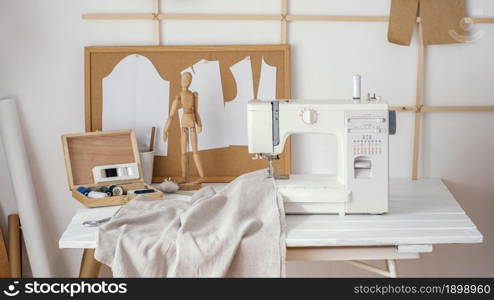 front view tailoring studio with sewing machine. Resolution and high quality beautiful photo. front view tailoring studio with sewing machine. High quality beautiful photo concept