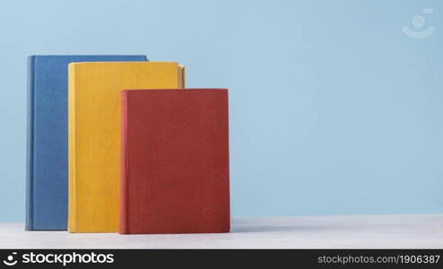 front view three colored books with copy space. High resolution photo. front view three colored books with copy space. High quality photo