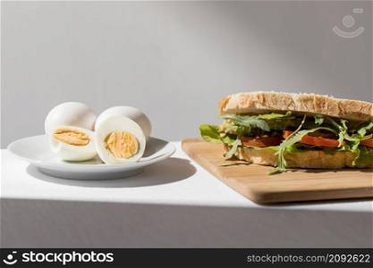 front view toast sandwich with tomatoes hard boiled eggs