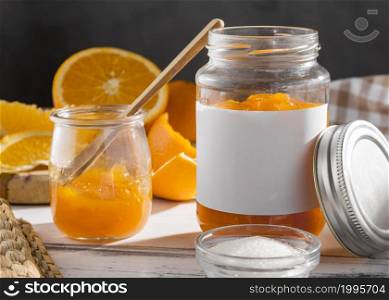 front view transparent jar with orange jam