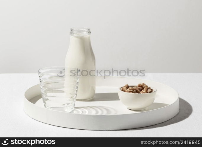 front view tray with milk bottle walnuts