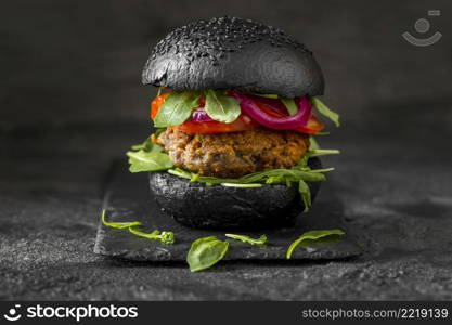 front view veggie burger with black buns