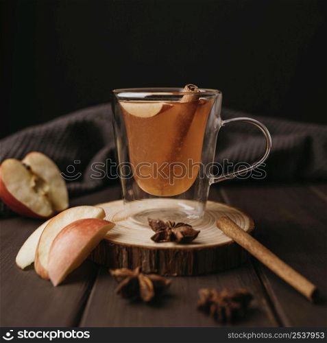 front view winter hot drink glass with apple cinnamon