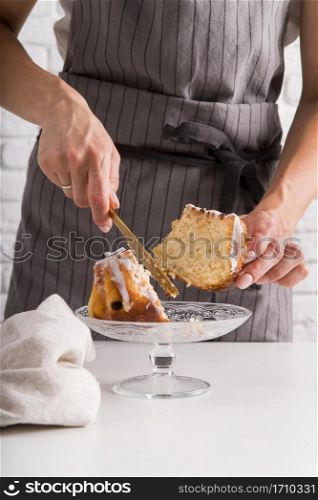 front view woman cutting pound cake