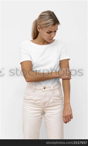 front view woman having elbow pain