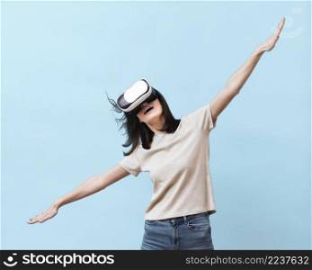 front view woman having fun with virtual reality headset