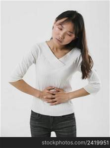 front view woman having stomachache