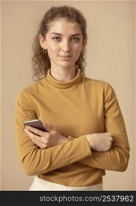 front view woman holding smart phone