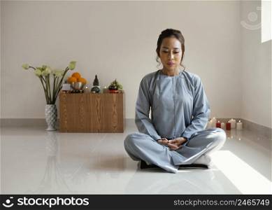 front view woman meditating with copy space 2