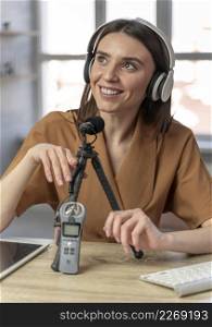 front view woman podcasting with microphone