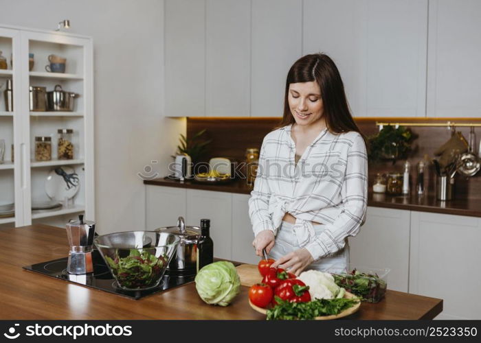 front view woman preparing food kitchen