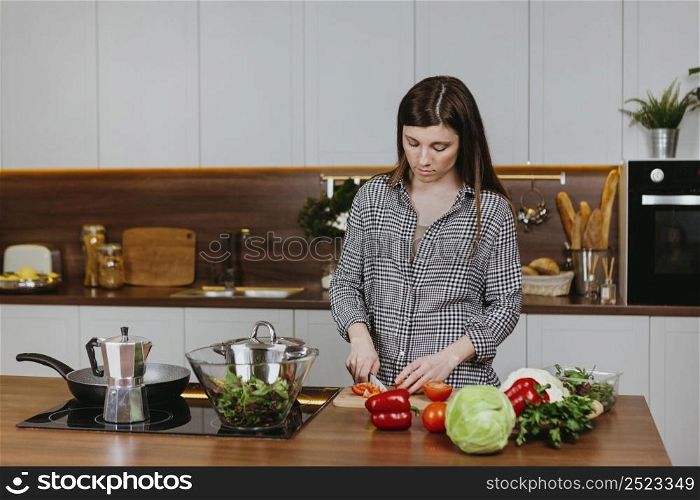 front view woman preparing food kitchen home