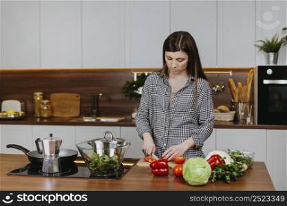 front view woman preparing food kitchen home
