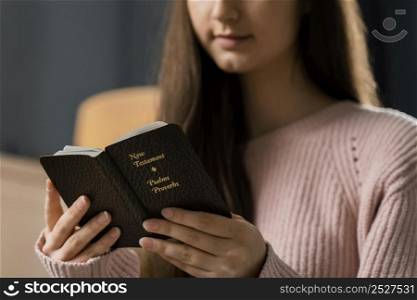 front view woman reading bible