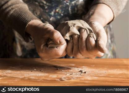 front view woman shaping clay. Resolution and high quality beautiful photo. front view woman shaping clay. High quality beautiful photo concept