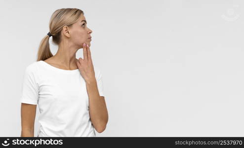 front view woman touching her chin check pain with copy space