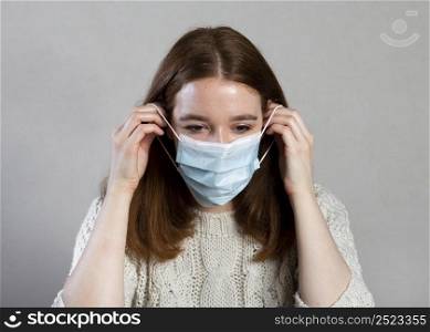 front view woman using medical mask protection