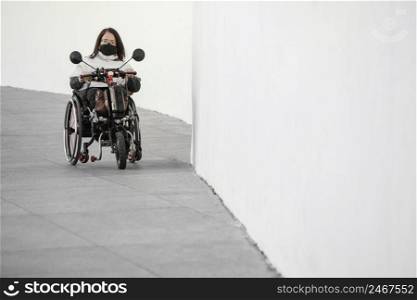 front view woman wheelchair with mask copy space