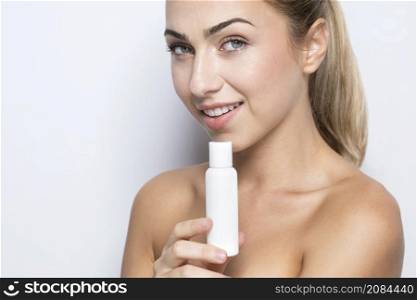 front view woman with beauty product concept