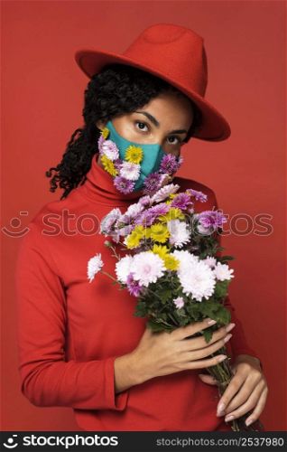 front view woman with mask bouquet flowers