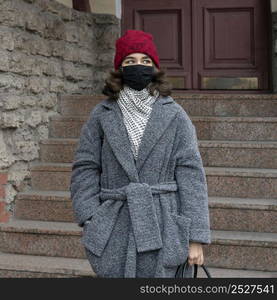 front view woman with medical mask outdoors