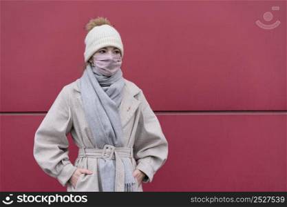 front view woman with medical mask outdoors copy space