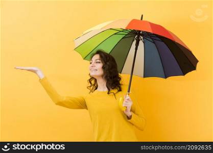 front view woman with rainbow umbrella