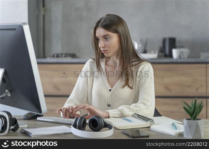 front view woman working media field with personal computer