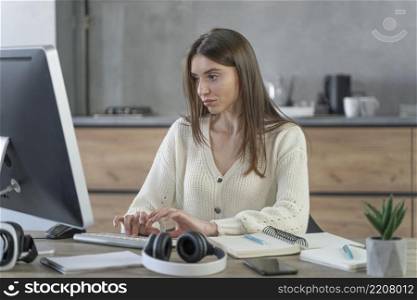 front view woman working media field with personal computer