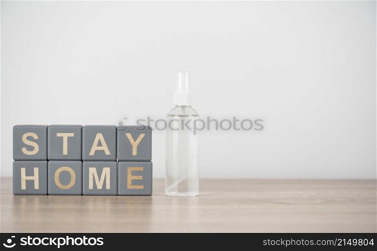 front view wooden cubes with stay home hand sanitizer