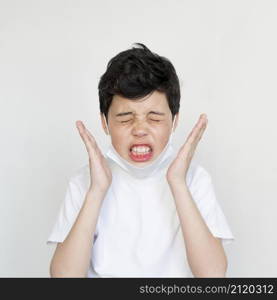 front view young boy sneezing