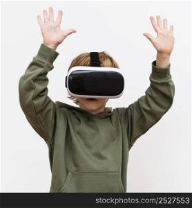 front view young boy using virtual reality headset