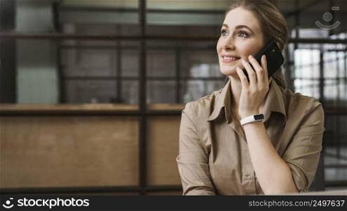 front view young businesswoman talking phone during meeting