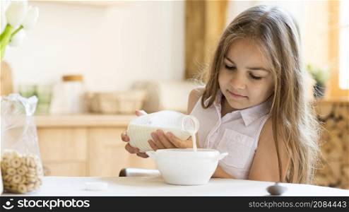 front view young girl eating cereals breakfast