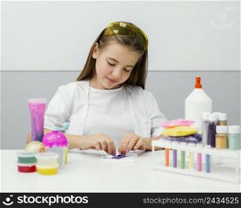 front view young girl scientist making slime