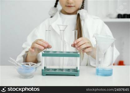 front view young girl scientist with test tubes