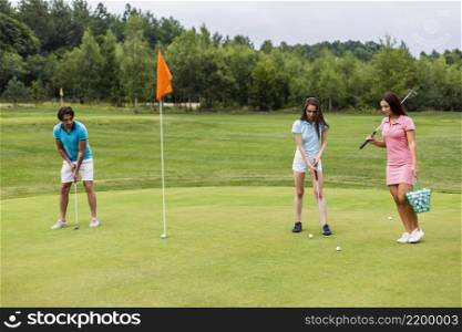 front view young golfers playing